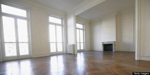 Large Empty Room with Wooden Floors