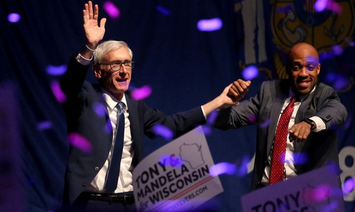 Evers, left, defeated Walker in the race for governor. 