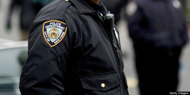 NEW YORK, NY - MARCH 18: New York CIty Police officers stand near a demonstration against the city's 'stop and frisk' searche