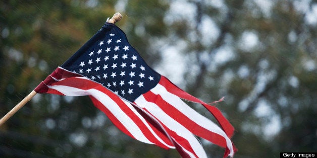 UNITED STATES - OCTOBER 30: A flag is ripped to shreds as the rain and winds begin to increase from Hurricane Sandy on Monday