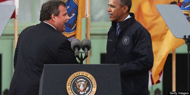 ASBURY PARK, NJ - MAY 28: President Barack Obama stands with New Jersey Gov. Chris Christie before speaking to crowds along a rain soaked boardwalk on May 28, 2013 in Asbury Park, New Jersey. Seven months after Superstorm Sandy devastated the region, President Obama declared that the Jersey Shore is back in an appearance with the governor. (Photo by Spencer Platt/Getty Images)