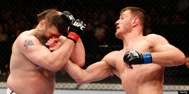 WINNIPEG, CANADA - JUNE 15: (R-L) Stipe Miocic punches 'Big Country' Roy Nelson in their heavyweight fight during the UFC 161 event at the MTS Centre on June 15, 2013 in Winnipeg, Manitoba, Canada. (Photo by Josh Hedges/Zuffa LLC/Zuffa LLC via Getty Images)