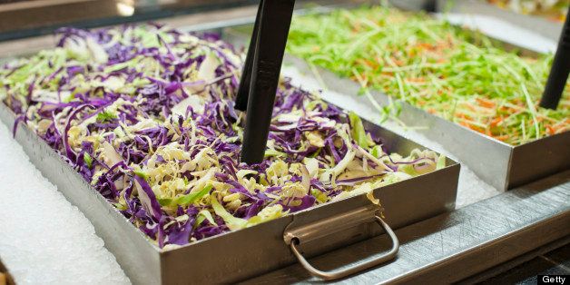 Salad bar, trays of fresh salads