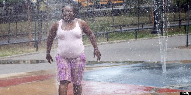 A woman cools down in water sprinklers July 8, 2010 in New York City.Stifling heat is expected to continue in Philadelphia, Washington and other parts of the US Northeast, with temperatures in the mid-90s Fahrenheit (35 Celsius) through tomorrow. AFP PHOTO/SAMANTHA EMMERT (Photo credit should read SAMANTHA EMMERT/AFP/Getty Images)