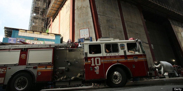 NEW YORK, NY - AUGUST 08: New York City firefighters converge near 1 World Trade Center after a welding incident led to reports of a possible fire in the high rise building on the former site of the World Trade Center on August 8, 2012 in New York City. Over 84 firefighters from 26 units responded to the morning reports of a fire in the building. There were no injuries reported in the building which is under construction and currently unoccupied. (Photo by Spencer Platt/Getty Images)