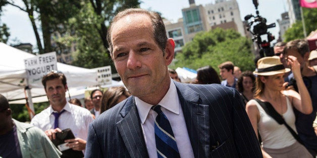 NEW YORK, NY - JULY 08: Former New York Gov. Eliot Spitzer collects signatures from citizens to run for comptroller of New York City on July 8, 2013 in New York City. Spitzer resigned as governor in 2008 after it was discovered that he was using a high end call girl service. (Photo by Andrew Burton/Getty Images)