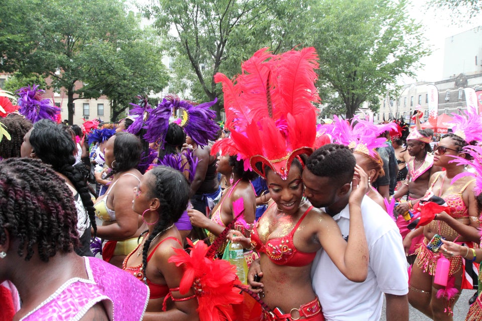 Parade participants make their way along Eastern Parkway in the Brooklyn borough of New York during the West Indian Day Parad