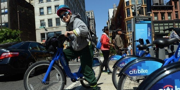 With AFP Story by Brigitte DUSSEAU: US-Transport-Bicycle-Share-CitiBikeLaura Glenn-Hershey rides a Citi Bike bicycle from a station near Union Square as the bike sharing system is launched May 27, 2013 in New York. About 330 stations in Manhattan and Brooklyn will have thousands of bicycles for rent. AFP PHOTO/Stan HONDA (Photo credit should read STAN HONDA/AFP/Getty Images)