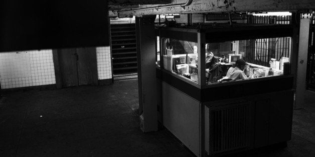 NEW YORK, NY - MAY 16: A subway station attendant sits in a booth of the Kingston-Throop Ave. station, where MTA worker Harry