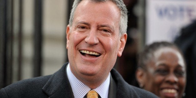 New York City Democratic mayoral candidate Bill de Blasio with his wife Chirlane McCray (R) speaks after voting at the Park Slope Branch Public Library in the Brooklyn borough of New York November 5, 2013. AFP PHOTO/Stan HONDA (Photo credit should read STAN HONDA/AFP/Getty Images)