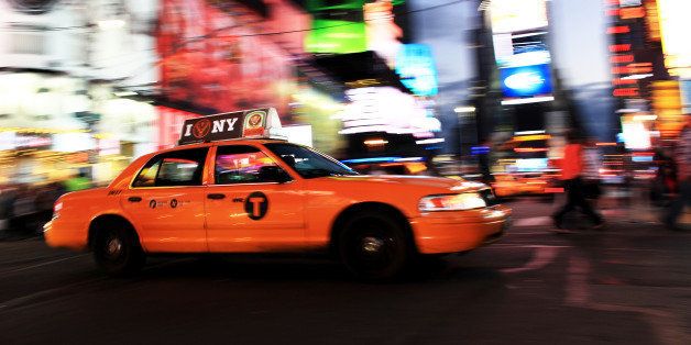 [UNVERIFIED CONTENT] I Heat NY taxi cab zooms through Times Square at dusk.