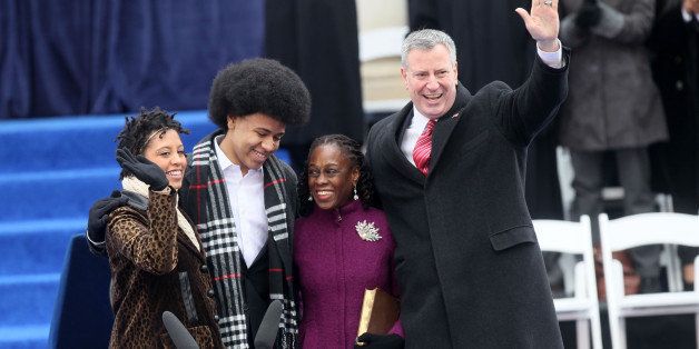 NEW YORK, NY - JANUARY 01: Bill De Blasio with his family Chirlane De Blasio, Chiara De Blasio and Dante De Blasio at the inaguration ceremony on the steps of City Hall making him NYC's 109th mayor on January 1, 2014 in New York City. (Photo by Steve Sands/WireImage)