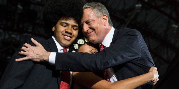 NEW YORK, NY - NOVEMBER 05: Newly elected New York City Mayor Bill de Blasio (R) hugs his son Dante de Blasio (L) and daught