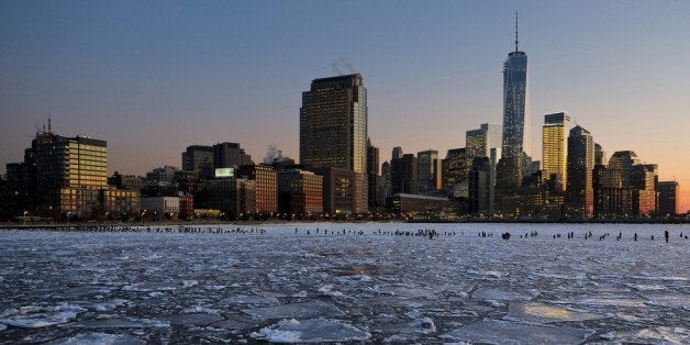 NEW YORK, NY - JANUARY 09: Ice floes fill the Hudson River as the Lower Manhattan skyline is seen during sunset on January 9