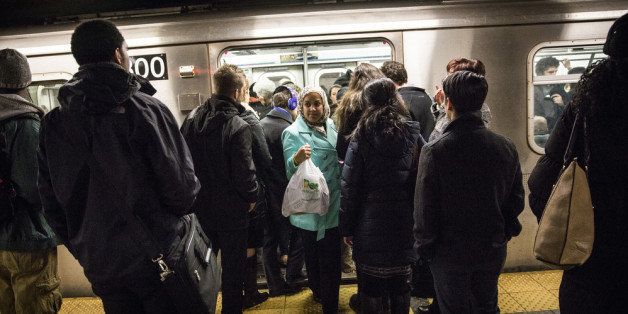 NEW YORK, NY - MARCH 10: Commuters wait to board a New York City subway car at Grand Central Terminal during evening rush hour on March 10, 2014 in New York City. New statistics revealed that public transit ridership is at its highest since 1956. (Photo by Andrew Burton/Getty Images)
