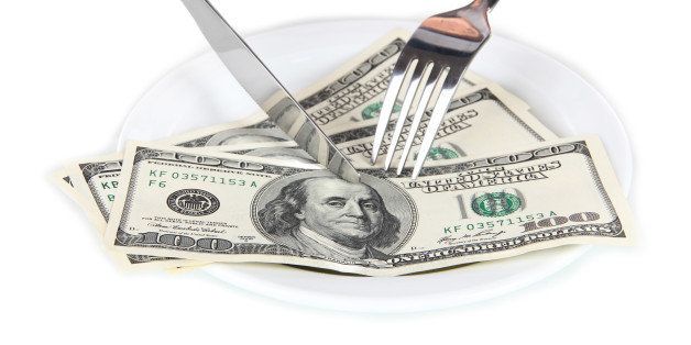 money on plate isolated on white