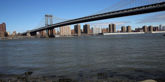 NEW YORK, NY - MARCH 31: The Manhattan Bridge is viewed from a park in Brooklyn that saw severe flooding during Hurricane Sandy on March 31, 2014 in New York City. A new report released Monday by the Intergovernmental Panel on Climate Change, a United Nations group that summarizes climate science, gave a dire picture of the earth's slow warming due to greenhouse gases and other human based behaviors. The report warned that countries and cities located along the coastline face a particular danger as the oceans continue to rise resulting in large scale flooding and erosion. (Photo by Spencer Platt/Getty Images)