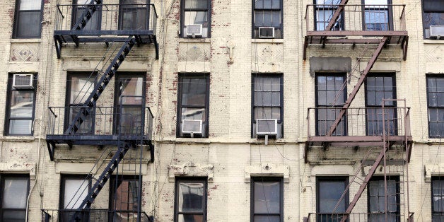 NEW YORK CITY, UNITED STATES - SEPTEMBER 24: Decayed facade of an apartment building in Manhattan on September 24, 2014, in N