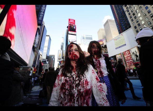 People dressed as zombies participate in
