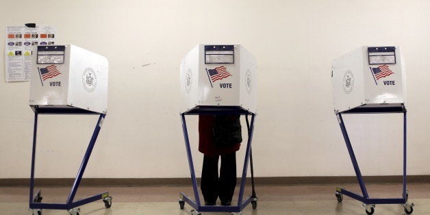 A voter is seen at a polling station during the New York primary elections in the Manhattan borough of New York City, U.S., April 19, 2016. Nearly half of Americans believe that the system that U.S. political parties use to pick their candidates for the White House is "rigged" and two-thirds want to see the process changed, according to a Reuters/Ipsos poll. REUTERS/Brendan McDermid/File Photo