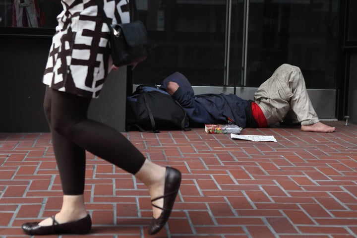 SAN FRANCISCO - SEPTEMBER 16: A homeless man sleeps in the doorway of a closed store on September 16, 2010 in San Francisco, California. The U.S. poverty rate increased to a 14.3 percent in 2009, the highest level since 1994. (Photo by Justin Sullivan/Getty Images)