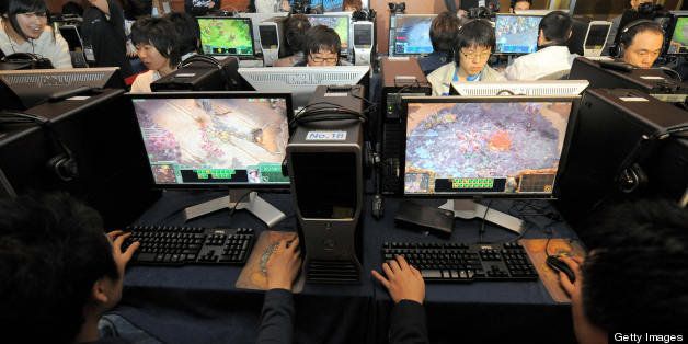 South Koreans test a new version of 'StarCraft 2' which has upgraded the 'Zerg' species of character, during a press conference by US game developer Blizzard Entertainment in Seoul on March 10, 2008. Starcraft is South Korea's most popular on-line game which has attracted millions of players. AFP PHOTO/JUNG YEON-JE (Photo credit should read JUNG YEON-JE/AFP/Getty Images)