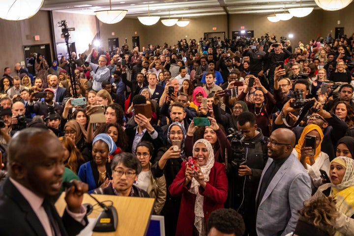 Supporters wait eagerly for the arrival of Ilhan Omar, newly elected to the U.S. House of Representatives, during her election night victory party.