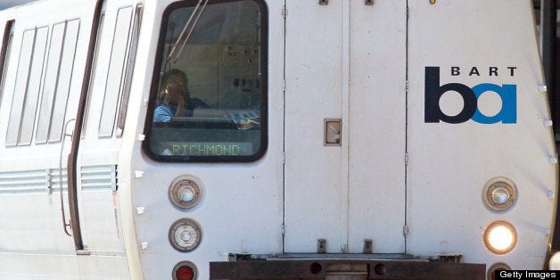 DALY CITY, CA - AUGUST 15: A Bay Area Rapid Transit (BART) train operator waits for passengers to enter the train at the Dal