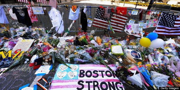 BOSTON, MA - APRIL 21: Items are placed by people visiting a makeshift memorial for victims near the site of the Boston Marathon bombings at the intersection of Boylston Street and Berkley Street two days after the second suspect was captured on April 21, 2013 in Boston, Massachusetts. A manhunt for Dzhokhar A. Tsarnaev, 19, a suspect in the Boston Marathon bombing ended after he was apprehended on a boat parked on a residential property in Watertown, Massachusetts. His brother Tamerlan Tsarnaev, 26, the other suspect, was shot and killed after a car chase and shootout with police. The bombing, on April 15 at the finish line of the marathon, killed three people and wounded at least 170. (Photo by Kevork Djansezian/Getty Images)