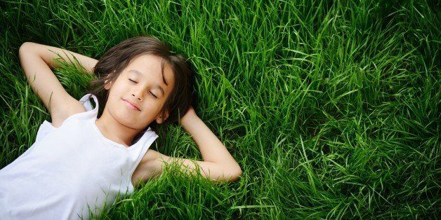 happy child enjoying on grass...