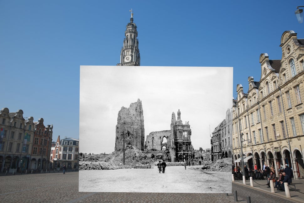 The colored photograph shows people walking near the Place des Heros in Arras, France, on March 14, 2014. The black and white