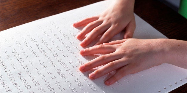 Blind child reading Braille (Photo by Universal Images Group via Getty Images)