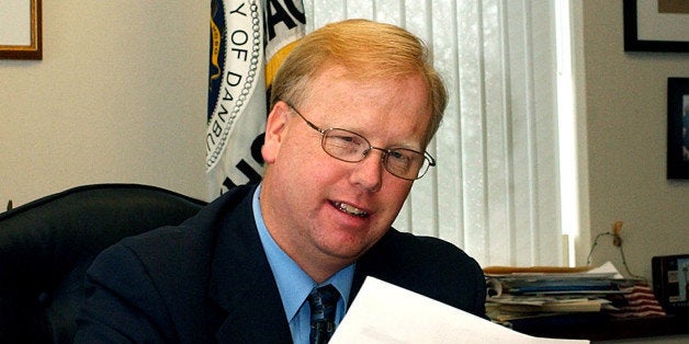 ** ADVANCE FOR SUNDAY, APRIL 13 ** Danbury, Conn., Mayor Mark Boughton works at his desk at City Hall in Danbury, Conn., Friday, April 11, 2003. Boughton, a Republican and a former high school teacher, is in charge of a financially stressed city where 17 municipal positions were eliminated to cut costs. So when the superintendent of schools asked for $500,000 and 14 new staffers to help implement President Bush's No Child Left Behind Act, Boughton had to say no. (AP Photo/Bob Child)