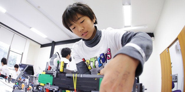 SYDNEY, AUSTRALIA - JULY 05: A child from Japan operates his robot at the LEGO Education FIRST Robot Games Tournament on July
