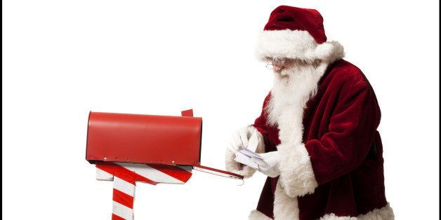 santa getting mail out of his mailbox