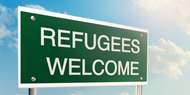 Refugees welcome as a road sign