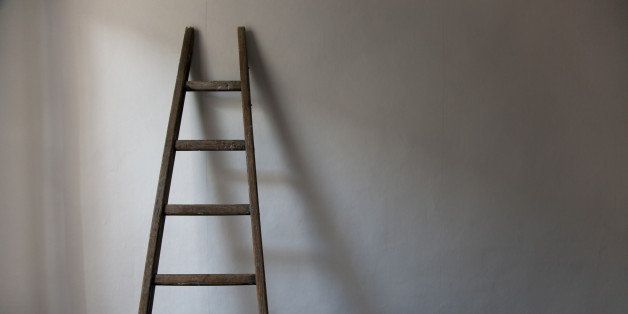 Old wooden ladder in north lit room in the south of France.