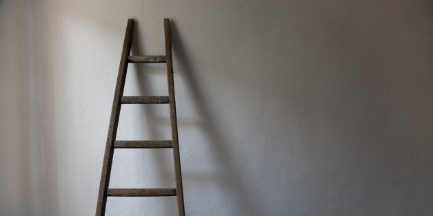 Old wooden ladder in north lit room in the south of France.