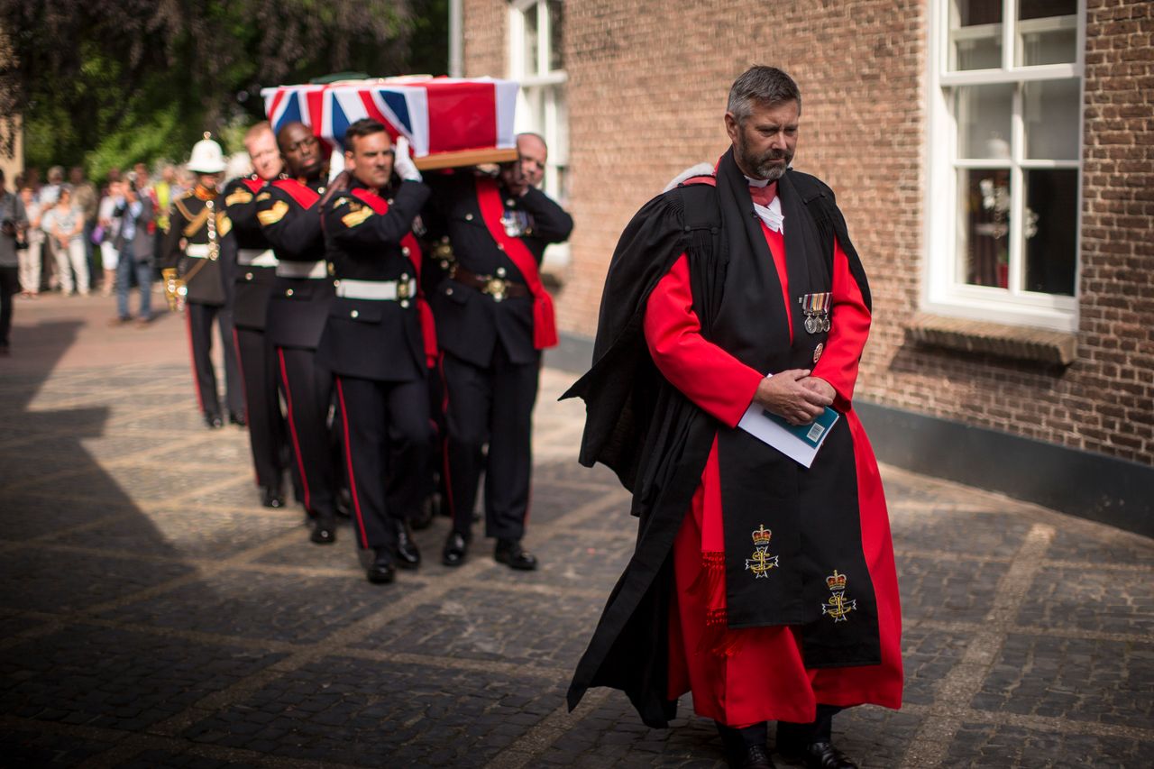 The coffin of David Williams, being carried by members of the Royal Marines 