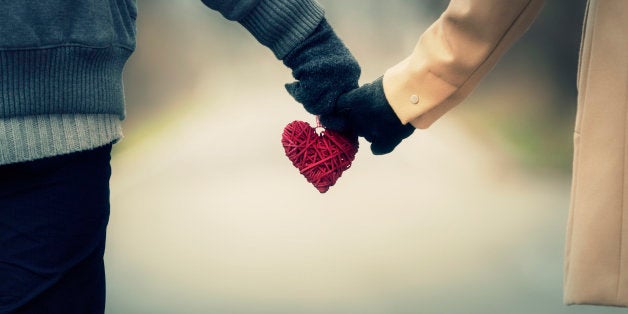 Couple in love holding hearts.