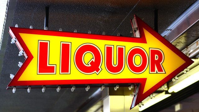 liquor sign pointing the way in ...