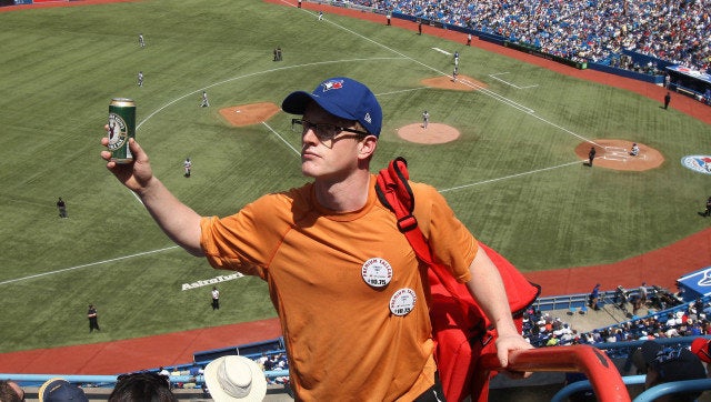 TORONTO, CANADA - MAY 20: A vendor sells beer during MLB game action between the New York Mets and the Toronto Blue Jays on May 20, 2012 at Rogers Centre in Toronto, Ontario, Canada. (Photo by Tom Szczerbowski/Getty Images)