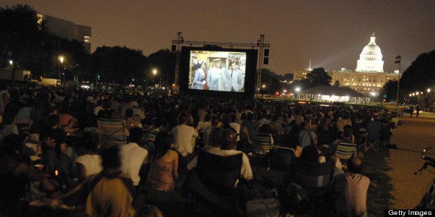UNITED STATES - JULY 25: An audience gathers on the mall Screen on the Green, a summer movie series on Monday nights at sunset on the National Mall. (Photo By Philip Scott Andrews/Roll Call/Getty Images)