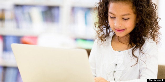 girl at school using a laptop...