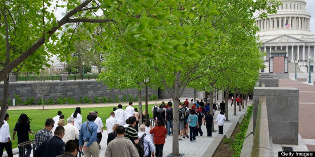 UNITED STATES - APRIL 19: Tourists return after U.S. Capitol Police evacuated the Visitor Center and parts of the East Front of the Capitol after a suspicious package was found. Security around the area remains high as the Boston bombing investigation unfolds. (Photo by Chris Maddaloni/CQ Roll Call)