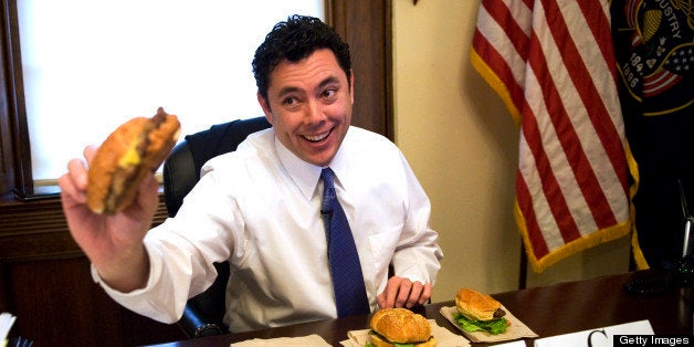 UNITED STATES - MARCH 03: Rep. Jason Chaffetz, R-Utah, samples cheeseburger from the House food vendors as part of a taste test held by Roll Cal. Mar. 3, 2010. He choose number 3, from the Cannon takeout, as the best tasting. (Photo By Tom Williams/Roll Call/Getty Images)