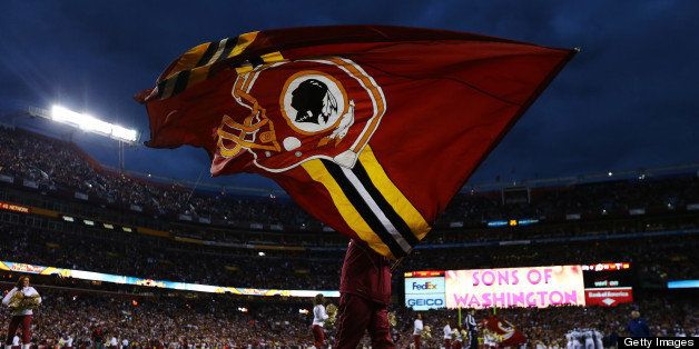 LANDOVER, MD - JANUARY 06: A Washington Redskins flag is waved prior to the NFC Wild Card Playoff Game against the Seattle Seahawks at FedExField on January 6, 2013 in Landover, Maryland. (Photo by Al Bello/Getty Images)