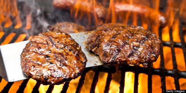 Burgers on Grill with Bratwurst and Flames