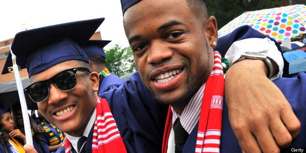 WASHINGTON, DC - MAY 11, 2013: Howard University graduates Nick Sneed(L) and Julian Lewis (R) enjoy the moment before the start of the commemcement ceremony on May, 11, 2013 in Washington, DC.(Photo by Mark Gail/For The Washington Post via Getty Images)