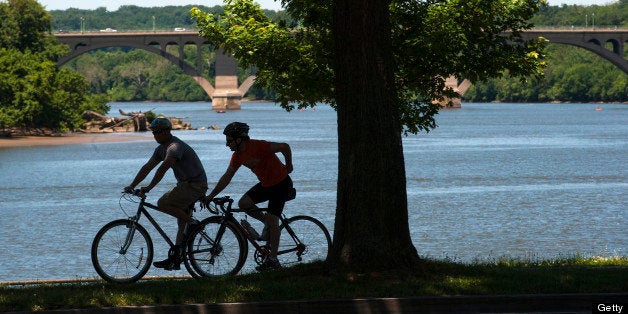 WASHINGTON, DC - JUNE 4: Bikers make their way along the Potomac River on the Rock Creek path near the Kennedy Center Tuesday